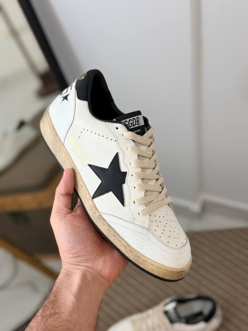Ball Star Distressed Leather Low-Top Sneakers in White and Black