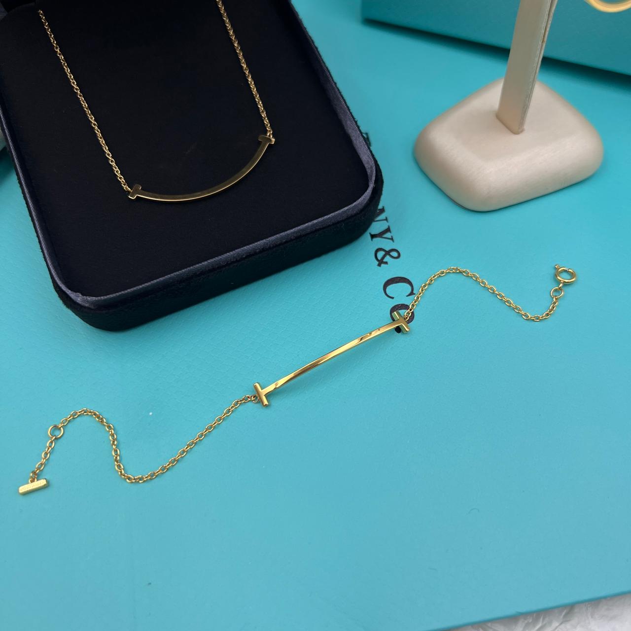 Tiffany & Co. 18K Yellow Gold T-Smile Pendant Necklace and Matching Bar Bracelet Set