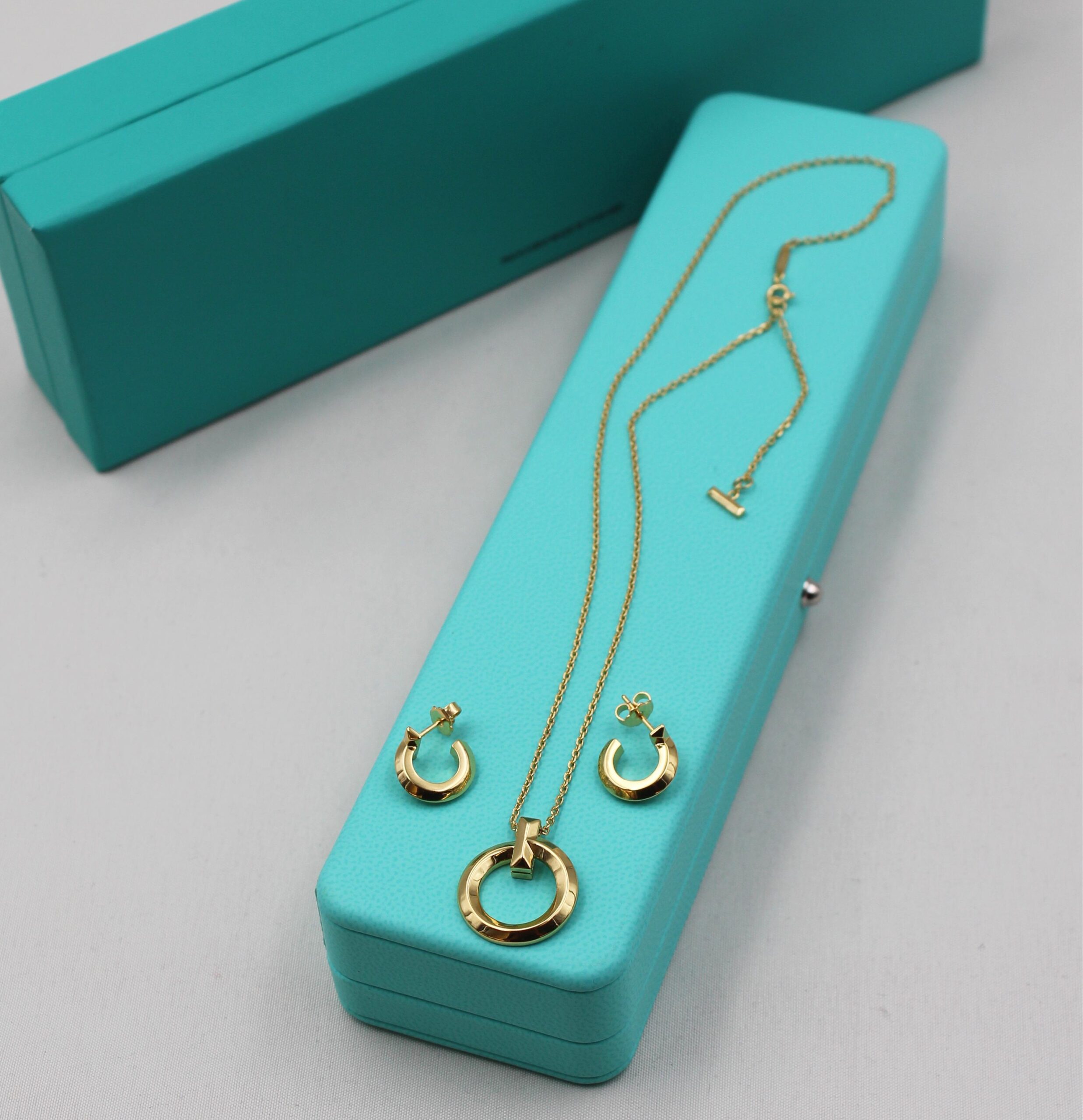 Tiffany & Co. 18K Yellow Gold T-Square Circular Pendant Necklace and Hoop Earrings Ensemble